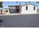 Cozy home featuring carport, desert landscaping, and neutral-colored exterior at 7807 E Main St # G-23, Mesa, AZ 85207