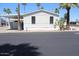 Cozy home featuring desert landscaping, carport, and neutral-colored exterior at 7807 E Main St # G-23, Mesa, AZ 85207