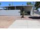 Exterior shot of a well-maintained mobile home with covered patio, fenced yard, and palm trees at 7807 E Main St # G-23, Mesa, AZ 85207