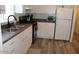 Practical kitchen with white cabinets, granite countertops, and an efficient layout at 7807 E Main St # G-23, Mesa, AZ 85207