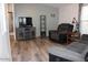Inviting living room with laminate flooring, neutral walls and a comfortable recliner at 7807 E Main St # G-23, Mesa, AZ 85207