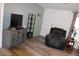 Inviting living room with laminate flooring, neutral walls and a comfortable recliner at 7807 E Main St # G-23, Mesa, AZ 85207
