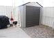 Storage shed with a grill and barbeque, next to an outdoor patio at 7807 E Main St # G-23, Mesa, AZ 85207
