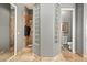 Bright bathroom featuring a glass block window, walk-in shower, and a toilet at 7940 E Quill Ln, Scottsdale, AZ 85255