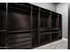 Spacious walk-in closet with custom built-in shelving and drawer systems at 7940 E Quill Ln, Scottsdale, AZ 85255