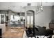 Open-concept kitchen with a breakfast bar, white cabinetry, and modern appliances, flowing into dining area at 7940 E Quill Ln, Scottsdale, AZ 85255