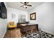 Bright office space with wood floors, a ceiling fan, and plenty of natural light at 7940 E Quill Ln, Scottsdale, AZ 85255