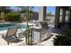 Outdoor kitchen area with a built-in stainless steel grill, perfect for outdoor cooking and entertaining at 7940 E Quill Ln, Scottsdale, AZ 85255