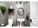 Stylish powder room with modern fixtures, vessel sink, elegant mirror, and sleek décor for guests at 7940 E Quill Ln, Scottsdale, AZ 85255