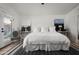 Bright, spacious bedroom with a minimalist design, featuring stylish decor, a cozy chair, and black and white accents at 8037 E Krail St, Scottsdale, AZ 85250
