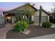 Charming home featuring desert landscaping with mature cacti, shrubs, and a manicured lawn, enhancing its curb appeal at 8037 E Krail St, Scottsdale, AZ 85250