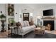 Cozy living room with a fireplace, comfortable sofa, and stylish decor creates an inviting and relaxing atmosphere at 8037 E Krail St, Scottsdale, AZ 85250