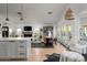 Open-concept living area featuring a modern kitchen, dining space, and comfortable seating at 8037 E Krail St, Scottsdale, AZ 85250