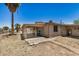 View of the backyard featuring a covered patio and partial fencing for added privacy at 8101 E 4Th Ave, Mesa, AZ 85208