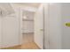 A basement with tile flooring and white painted walls and access to another room at 8101 E 4Th Ave, Mesa, AZ 85208