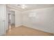 A bedroom with tile flooring, a window with blinds, and a doorway to another room at 8101 E 4Th Ave, Mesa, AZ 85208