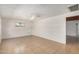 Bright living room featuring tile flooring, neutral paint, and a ceiling fan for added comfort at 8101 E 4Th Ave, Mesa, AZ 85208