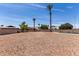 Large gravel backyard featuring a swimming pool and privacy wall, offering a private space for outdoor activities and relaxation at 8124 N 45Th Ave, Glendale, AZ 85302