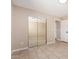 Bedroom with tile floors and mirrored closet at 8124 N 45Th Ave, Glendale, AZ 85302