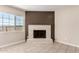 Inviting fireplace area with brick hearth and adjacent window creating a cozy atmosphere at 8124 N 45Th Ave, Glendale, AZ 85302