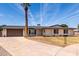 Charming home with a paved driveway, neat landscaping, and architectural symmetry at 8124 N 45Th Ave, Glendale, AZ 85302