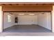 Spacious two-car garage, freshly painted with updated lighting, and includes a water heater and a door to the home at 8124 N 45Th Ave, Glendale, AZ 85302