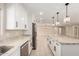 Elegant kitchen with a long island featuring granite countertops and sleek stainless steel appliances at 8124 N 45Th Ave, Glendale, AZ 85302