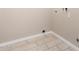 Laundry area featuring tiled floors and connections for a washer and dryer, ready for appliances at 8124 N 45Th Ave, Glendale, AZ 85302