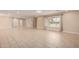 Bright, open living room with neutral flooring and large window, creating an airy feel at 8124 N 45Th Ave, Glendale, AZ 85302