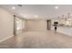Large living room showcasing an open concept with a modern kitchen and plenty of natural light at 8124 N 45Th Ave, Glendale, AZ 85302