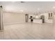 Expansive living area with tile flooring, seamlessly connected to the modern kitchen space at 8124 N 45Th Ave, Glendale, AZ 85302