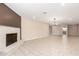 Open living room featuring tile floors, a fireplace, and neutral walls for versatile decorating at 8124 N 45Th Ave, Glendale, AZ 85302