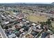This aerial view highlights a neighborhood with a lake and community pool at 8326 E Valley View Rd, Scottsdale, AZ 85250