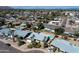 Aerial view of a charming neighborhood featuring well-maintained homes and refreshing pools, surrounded by lush greenery at 8326 E Valley View Rd, Scottsdale, AZ 85250