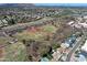 An aerial perspective reveals houses near baseball fields with mountain views at 8326 E Valley View Rd, Scottsdale, AZ 85250