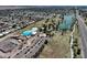 Aerial view showcasing a community pool and lake in a well-connected neighborhood at 8326 E Valley View Rd, Scottsdale, AZ 85250