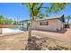 This home's backyard has pool access, with fruit trees and covered patio at 8326 E Valley View Rd, Scottsdale, AZ 85250