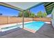 Inviting backyard featuring a refreshing swimming pool with a diving board, perfect for relaxation at 8326 E Valley View Rd, Scottsdale, AZ 85250