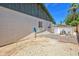 Rear exterior showcasing the white brickwork, fenced yard, and pool at 8326 E Valley View Rd, Scottsdale, AZ 85250
