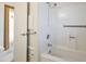 Bathroom showing a bathtub with showerhead and safety handles for comfortable bathing at 8326 E Valley View Rd, Scottsdale, AZ 85250