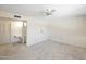 Spacious bedroom features a ceiling fan and ensuite bathroom with ample natural light at 8326 E Valley View Rd, Scottsdale, AZ 85250