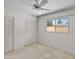 Bedroom featuring a window, ceiling fan, carpeted floor, and closet with plenty of storage at 8326 E Valley View Rd, Scottsdale, AZ 85250