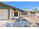 Charming exterior highlighting the home's entrance, well-kept lawn, and neighborhood view at 8326 E Valley View Rd, Scottsdale, AZ 85250