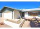A well-maintained single-story home with an attached garage, complemented by desert landscaping at 8326 E Valley View Rd, Scottsdale, AZ 85250