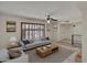 Comfortable living room features a gray sofa, wood coffee table and neutral decor at 8326 E Valley View Rd, Scottsdale, AZ 85250