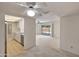 A bright living room boasts neutral carpet, view into kitchen and access to covered outdoor patio at 8326 E Valley View Rd, Scottsdale, AZ 85250