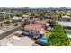 Elevated view of a neighborhood, showcasing homes with backyard pools, lush landscaping, and mountain backdrop at 8931 W Alex Ave, Peoria, AZ 85382
