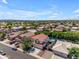 Overhead view of a home and neighborhood featuring well-kept homes, pools, and scenic mountain views at 8931 W Alex Ave, Peoria, AZ 85382