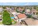 An aerial view of a neighborhood showcasing houses, streets, and blue swimming pool at 8931 W Alex Ave, Peoria, AZ 85382