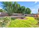 Large backyard with mature trees, lush lawn, desert landscaping and an above-ground pool at 8931 W Alex Ave, Peoria, AZ 85382